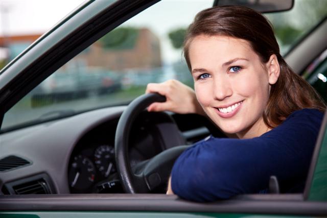 Attractive young woman in car